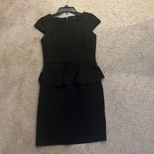 A black formal dress that is very plain and simple. Can be dressed up or down.